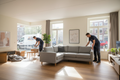 Professional movers delivering and assembling furniture in an Amsterdam apartment